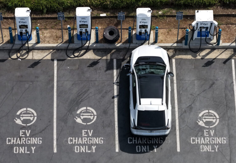 An electric vehicle charges at an EVgo electric charger in Monrovia, Calif.