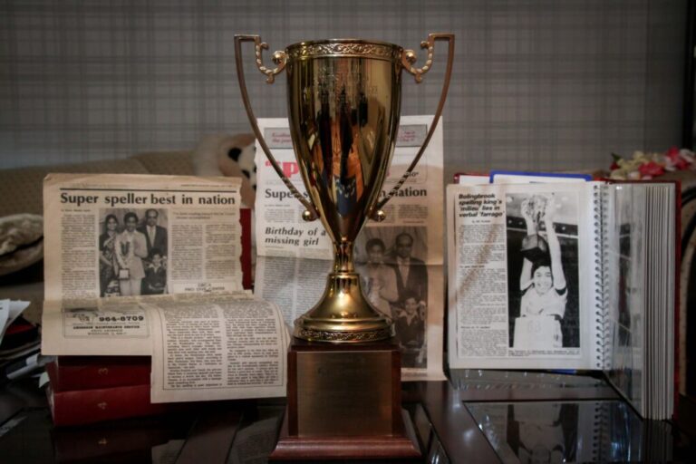 Balu Natarajan won the Scripps National Spelling Bee in 1985. Shown are his trophy and newspaper clippings detailing his win.