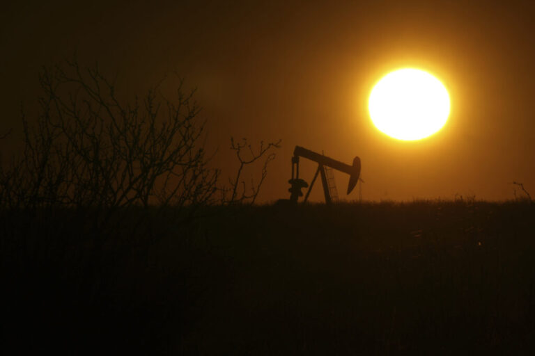 A pumping jack is visible in silhouette against an orange-sky sunrise on Feb. 24, 2025, in Hobbs, New Mexico.