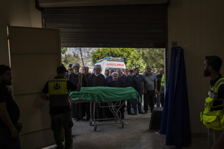 Saida, Lebanon — May 13, 2026. Religious leaders pray for a Lebanese civilian recently killed in southern Lebanon. Since the war erupted on March 2, 2026, 2,882 people have been killed. During the ceasefire, 380 people have been killed. Diego Ibarra Sánchez for NPR.