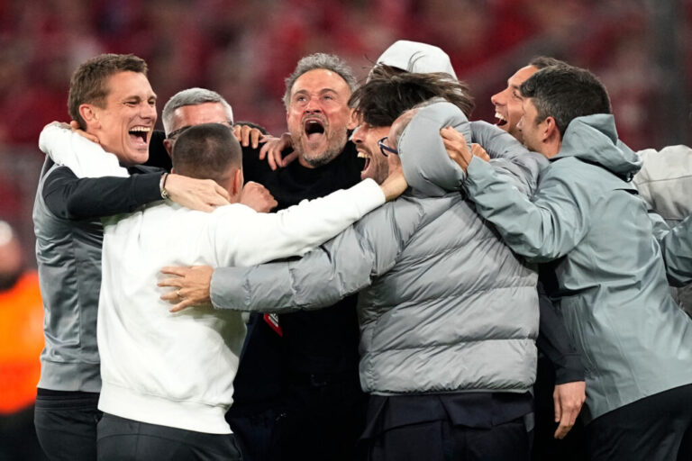 PSG's head coach Luis Enrique, center, celebrates with the other members of the team after the Champions League semifinal second leg soccer match between Bayern Munich and Paris Saint Germain in Munich, Germany, Wednesday, May 6, 2026.
