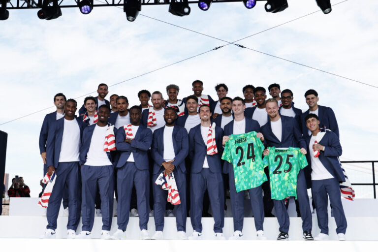 Players of the United States pose for a team photo on stage during the U.S. Soccer World Cup roster reveal on Tuesday in New York City.