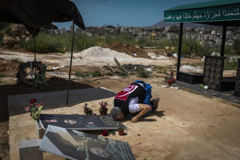 Nabatieh, Lebanon. May 14, 2026. Mohammed Suleiman, Nabatieh’s chief paramedic prays at the grave of his son Joud Suleimanwas killed in an Israeli strike in March, along with Ali Jaber, 24, while they were on their way to a rescue mission. Diego Ibarra Sánchez