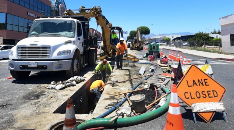 A roadworks crew works in Monterey Park, California on June 24, 2021.
