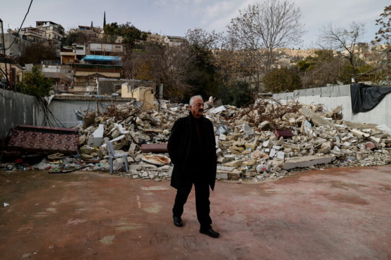 Fakhri Abu Diab, a community leader, walks by the remains of his family home, after it was destroyed by Israeli forces, in the Silwan neighborhood of East Jerusalem.
