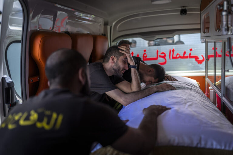 Nabatiyeh, Lebanon — May 13, 2026. Members of the Civil Defense team mourn the loss of Lebanese Civil Defense members Hussein Jaber and Ahmad Noura, who were killed in an Israeli strike on the southern town of Nabatieh on May 12, 2026. Diego Ibarra Sánchez for NPR.