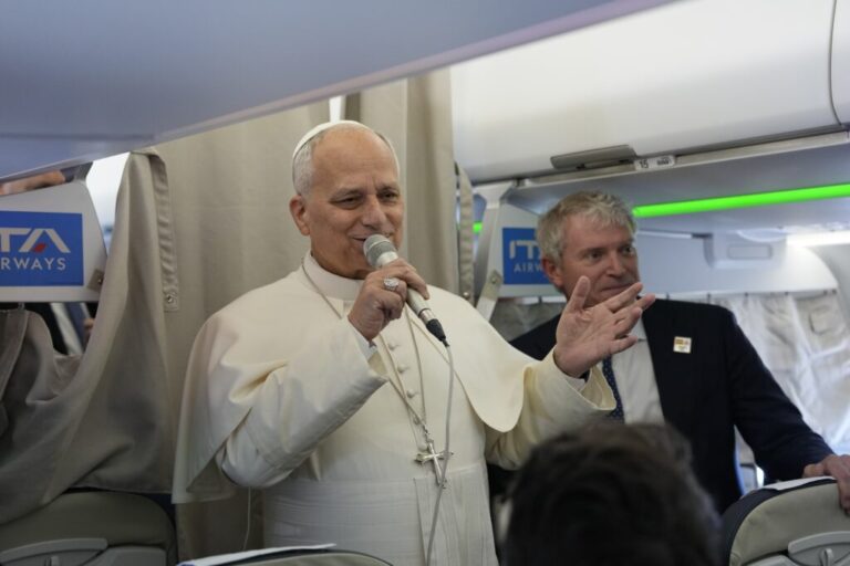 Pope Leo XIV talks to journalists aboard the papal flight from Rome to Madrid on June.