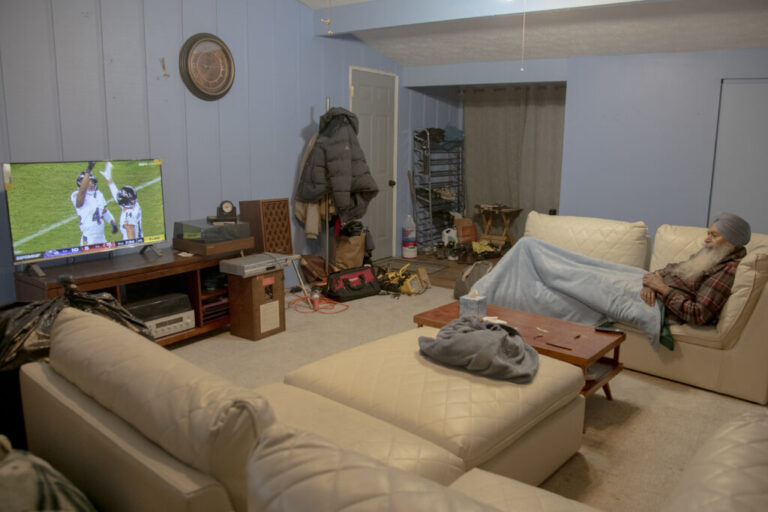 Jagbir Singh Dhillon, 81, watches a football game from his couch on Christmas, immersed in the sport. A former hockey player in India, Dhillon moved to the U.K. and then the U.S. in the 1970s seeking better opportunities. Football was unfamiliar when he arrived in America, but over four decades he developed a genuine love for the game and enjoyed it purely for the thrill of the sport. His passion reflects how immigrant experiences can blend with American traditions, and how love for sports can connect people across generations and backgrounds.