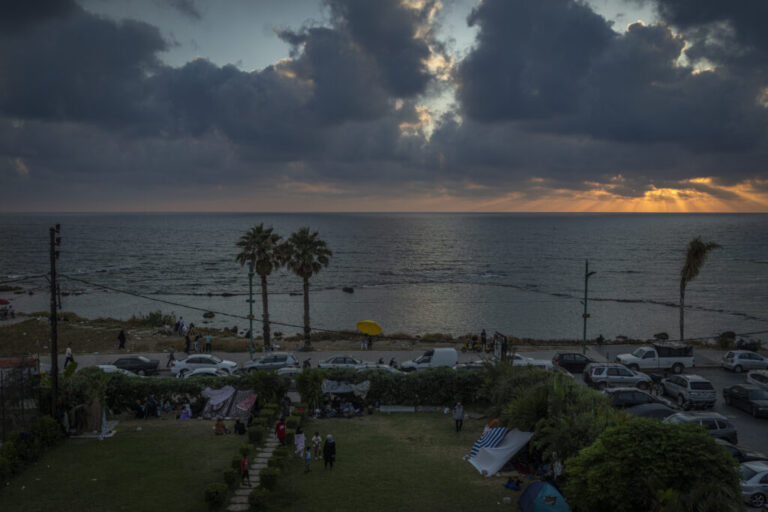 Tyre, Southern Lebanon — June 7, 2026. Displaced people sleep in the Christian area overlooking the corniche, taking shelter after evacuation warnings and destruction caused by Israeli airstrikes on residential areas in Tyre. The escalation between Israel and Hezbollah has displaced more than one million people, deepening an already severe humanitarian crisis and complicating ceasefire efforts. Diego Ibarra Sánchez for NPR.