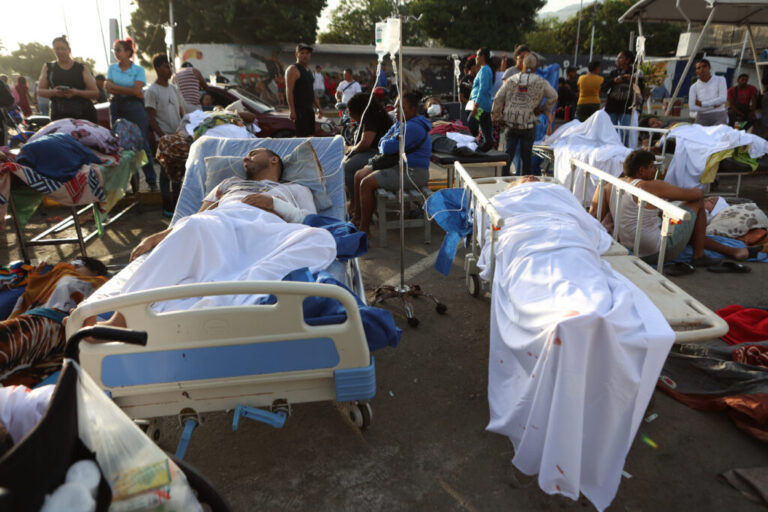 Patients lie outside a hospital evacuated after it was damaged in an earthquake in Catia La Mar, Venezuela, Thursday, June 25, 2026.