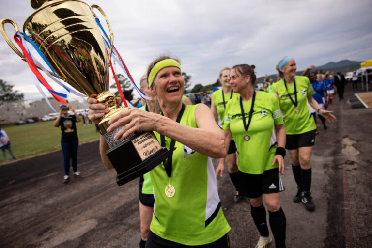 New England Boston Breakers hoist winning trophy.