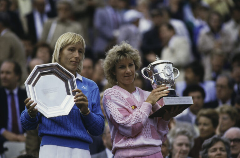 Martina Navratilova and Chris Evert hold their trophies after Evert beat Navratilova to win the Women's Singles title at the French Open in 1986.