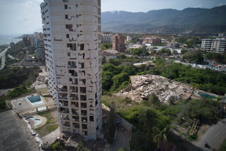 Damaged buildings stand a day after earthquakes struck La Guaira, Venezuela.