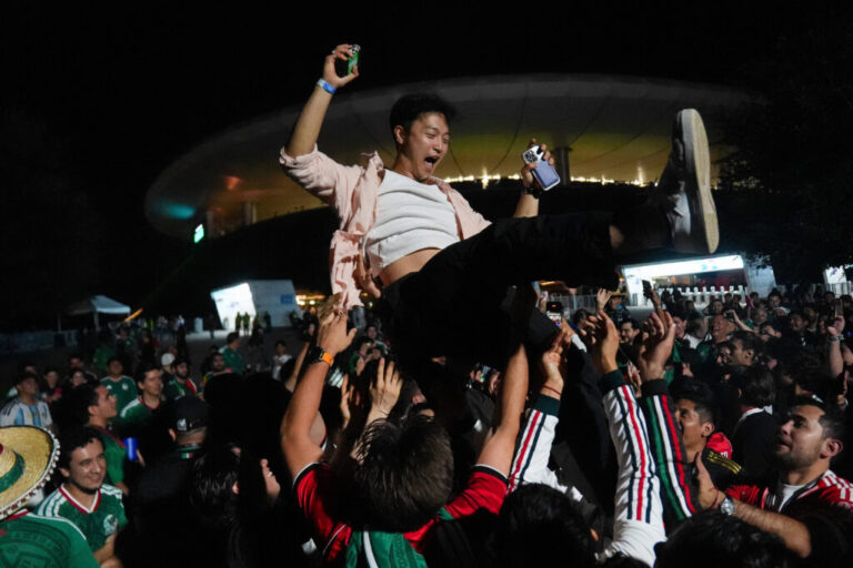 A fan is lifted up, as South Korean fans celebrate with Mexican fans outside the stadium, after the match between South Korea and the Czech Republic at the FIFA World Cup 2026, in Guadalajara, Mexico, June 11, 2026.
