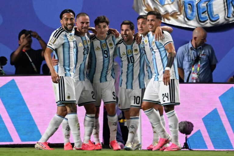 Argentina's forward #10 Lionel Messi celebrates with teammates scoring his team's second goal during their 2026 World Cup game against Algeria at the Kansas City Stadium. Messi would add a third as Argentina began defense of its 2022 title.