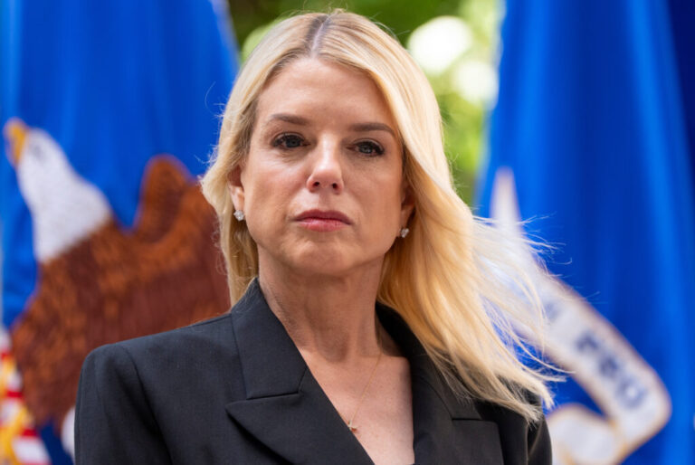 Attorney General Pam Bondi listens during a news conference at the Department of Justice, Wednesday, May 7, 2025, in Washington. In late April, the DOJ's Department of Justice Programs cancelled hundreds of public safety grants to local police and non-profits, leaving many to scramble to replace the funding. Many are appealing the cuts. (AP Photo/Alex Brandon)