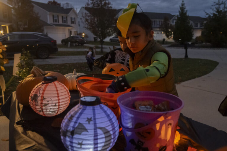 Agam Singh Brar, 7, collects candy in his Halloween costume in his neighborhood. His father moved to the United States several years ago in search of better opportunities. Agam chose to grow his hair after being inspired by his cousins in India, a decision fully supported by his family. His father takes pride in seeing him embrace his Sikh identity at such a young age while confidently navigating life as both an American and a Sikh. This reflects how younger Sikh Americans are learning to balance faith and belonging, proudly celebrating both their heritage and the culture they’re growing up in.