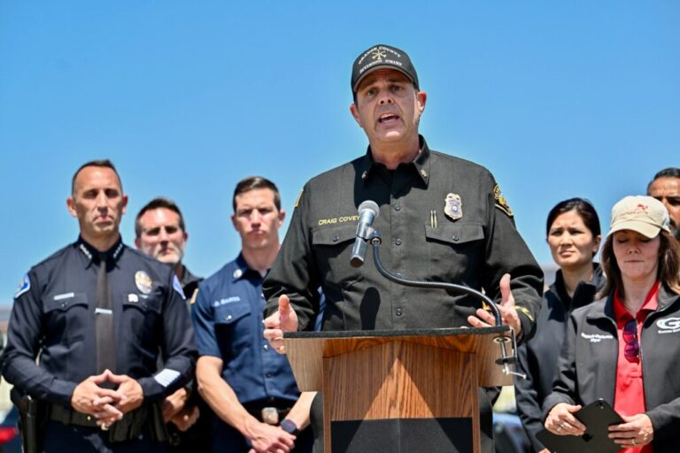 Orange County Fire Authority Division Chief Craig Covey speaks during a news conference at the Los Alamitos racetrack in Cypress, Calif., on Friday about a hazardous material situation in Garden Grove, Calif.