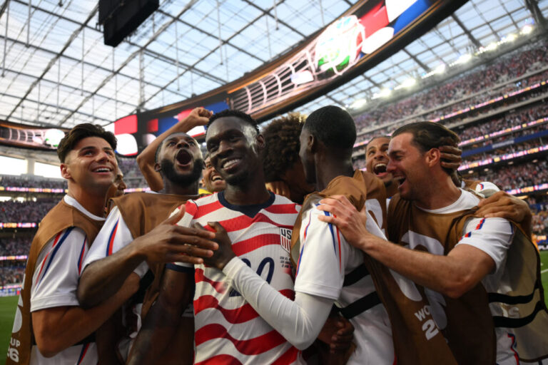 U.S. players celebrate after scoring.