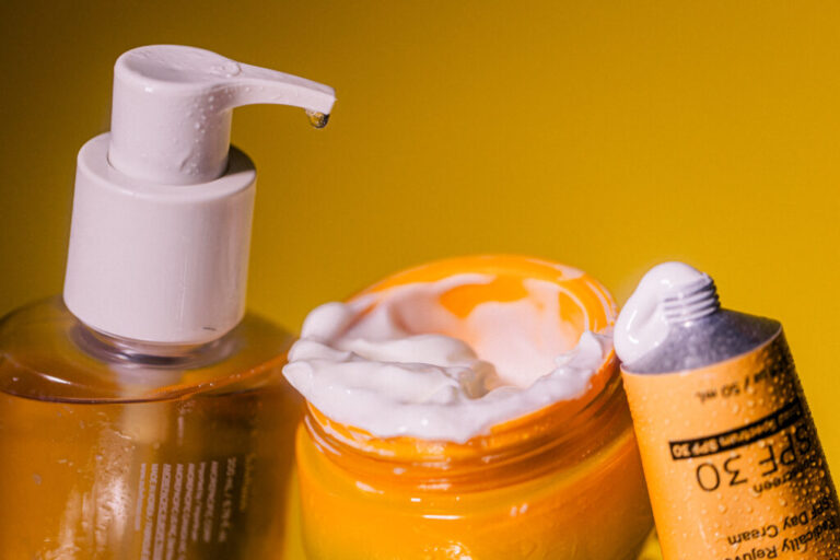 A bottle of cleanser, a jar of moisturizer and a tube of sunscreen