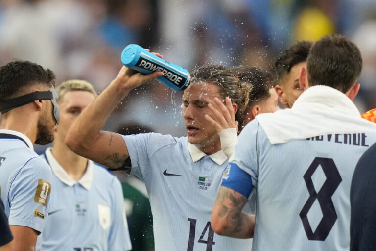 Uruguay's Agustin Canobbio cools off during a hydration break in a World Cup soccer match against Saudi Arabia in Miami Gardens, Fla., on June 15, 2026.