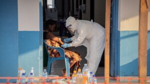 Balancing the risks of catching Ebola while covering the outbreak