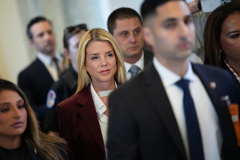 Former U.S. Attorney General Pam Bondi (center) arrives to testify at a closed-door interview with the House Oversight Committee on Capitol Hill on Friday in Washington, D.C. Lawmakers will ask Bondi questions about the federal government's handling of the Jeffrey Epstein case and release of related files to the public.