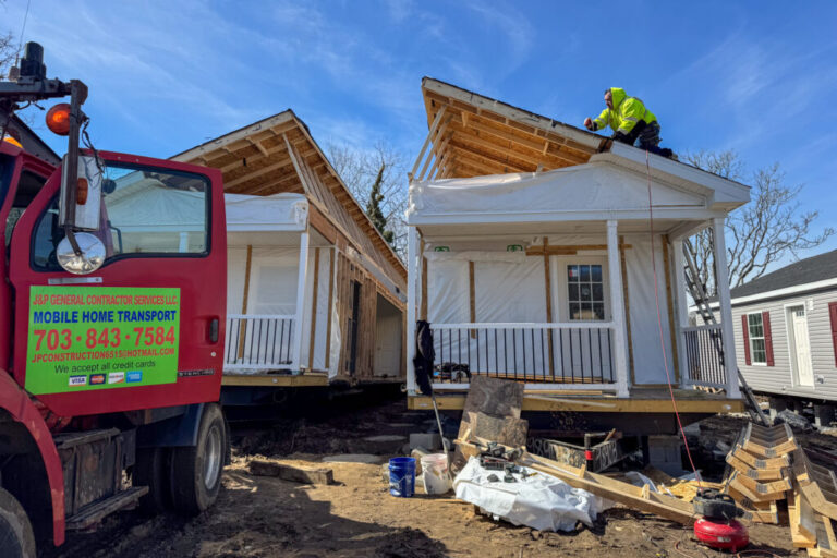 The left and right halves of a four-bedroom factory-built home are pushed together in Petersburg, Virginia.