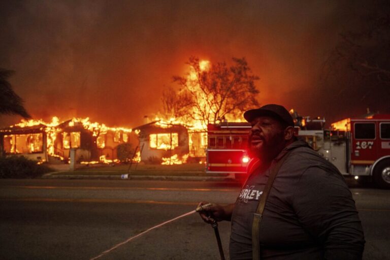 A resident of Altadena, Calif., tried to protect property during wildfires in January 2025.