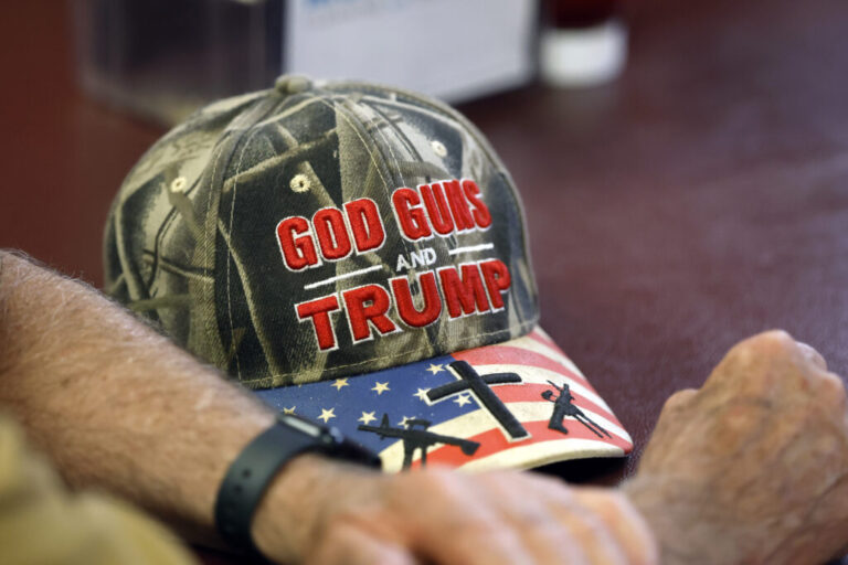 A detailed view of a hat that reads, God Guns and Trump is seen at a campaign event for U.S. Rep. Julia Letlow, a Republican from Louisiana, at Bourne's Restaurant on May 6, 2026 in Franklinton, La. Gun rights groups see ‘golden age’ under the Trump administration’s second term.