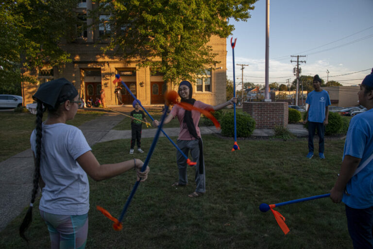 Jasleen Kaur Mann, 23, demonstrates a gatka move while teaching children at the Guru Gobind Singh Sikh Society of Cleveland gurdwara in Bedford, Ohio. Gatka, a traditional Sikh martial art, blends spiritual discipline with physical skill, symbolizing courage, self-defense, and faith. Teaching it to children helps preserve Sikh heritage and instill core values of bravery, respect, and community service across generations.