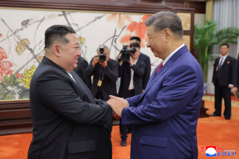 FILE - In this photo provided by the North Korean government, North Korean leader Kim Jong Un, left, shakes hands with Chinese President Xi Jinping in Beijing Thursday, Sept. 4, 2025. Independent journalists were not given access to cover the event depicted in this image distributed by the North Korean government. The content of this image is as provided and cannot be independently verified. Korean language watermark on image as provided by source reads:
