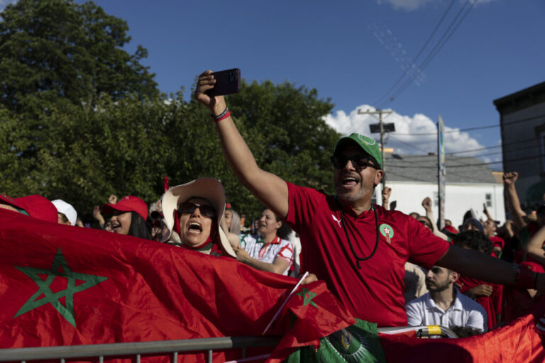 Supporters of Morocco wave flags and cheer during a watch party for the FIFA World Cup match against Brazil in Paterson, N.J on June 13.