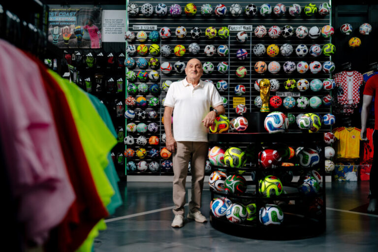 Rochester Hills, MI - June 10, 2026: Waad Sana, 58, owner of Soccer World since 1986, poses for a portrait at his Rochester Hills, MI store. (Photo by Nick Hagen for NPR)