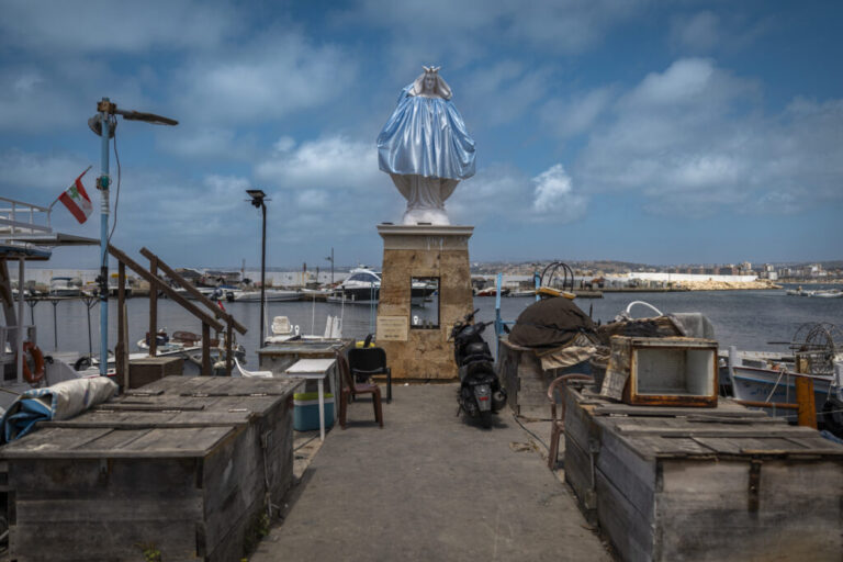 Tyre, Southern Lebanon — June 7, 2026. A statue of the Virgin Mary stands in the fishing port. The escalation between Israel and Hezbollah has displaced more than one million people, deepening an already severe humanitarian crisis and complicating ceasefire efforts. Diego Ibarra Sánchez for NPR.
