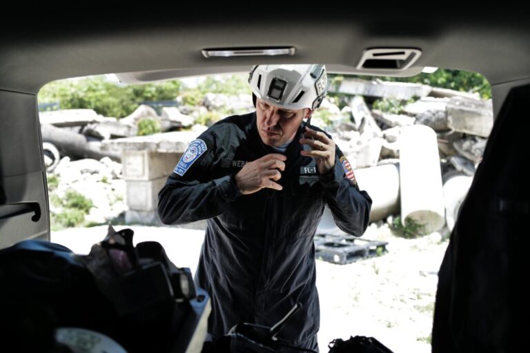 Chief Brandon Webb of Florida Task Force 1 puts on rescue gear at a training center in Miami.  The elite search and rescue team trains regularly on how to respond to calamities like the Surfside Collapse around the world.