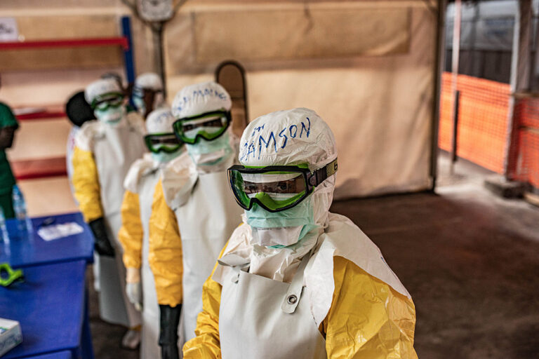 Health workers don protective equipment at an Ebola treatment center on June 2, 2026 in Monigi, Democratic Republic of Congo.