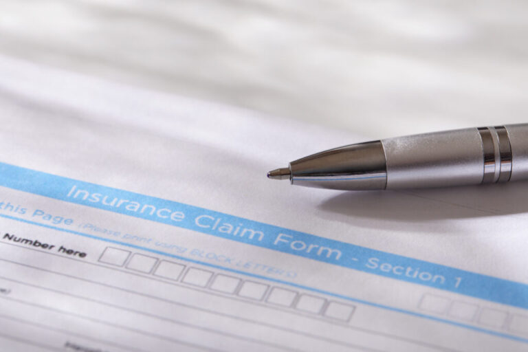 USA, New York, New York City, Close-up of insurance form with pen
