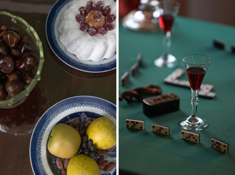 Tables are set up with displays of upper class dining at the William Paca House in Annapolis. Left: A table is set with fruit, nuts and cake. Right: Another table is set with dominoes and replica glasses of red punch.