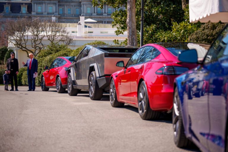 President Trump, accompanied by Tesla CEO Elon Musk and his son X Æ A-Xii, speaks next to a line of Tesla vehicles on the South Lawn of the White House on Tuesday. Trump said he would purchase a Tesla vehicle in what he calls a