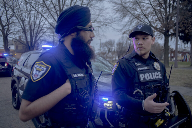 Officer E.M. Griffith talks with Sukhvir Singh Grewal, Ohio’s first and only turbaned police officer, during a patrol in Alliance. While Sikh officers have served in countries such as Canada, the U.K., and India for decades, Grewal’s role reflects growing diversity in Ohio law enforcement. His turban serves as a visible symbol of faith and identity, underscoring the importance of representation in professions that have historically lacked cultural inclusivity.