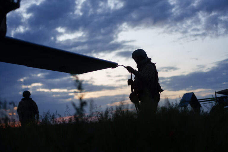 Soldiers form the First Center of Unmanned Systems preparing long/middle strike drones for launch