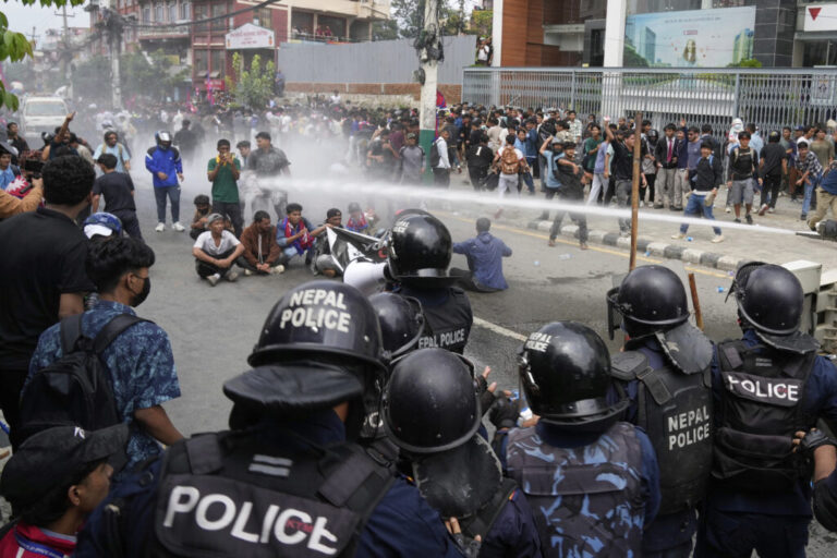 Riot police use a water cannon on protesters outside Parliament in Kathmandu, Nepal, Monday, Sept. 8, 2025.