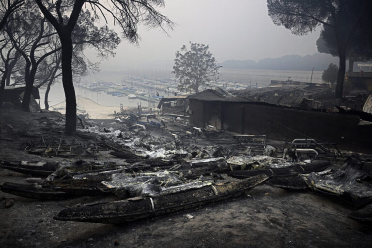 Charred pedalo boats are seen at the San Juan Reservoir after a wildfire ravaged the region in Pelayos de la Presa, 65 kilometers (40 miles) southwest of Madrid, on July 28, 2026.