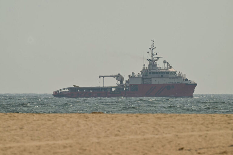 A ship sails off the coast of Ajman on Friday.