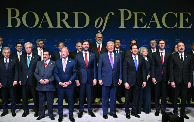 President Trump, flanked by Vice President JD Vance and Secretary of State Marco Rubio, joins leaders for a group photo during the inaugural meeting of the Board of Peace in Washington on Thursday.