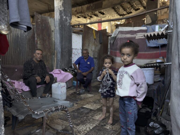 Subhi Shurabasi, a 60-year-old grandfather, shelters with his sons, their wives and his grandchildren inside the ruins of their destroyed home in al-Shujaiya, on May 31.