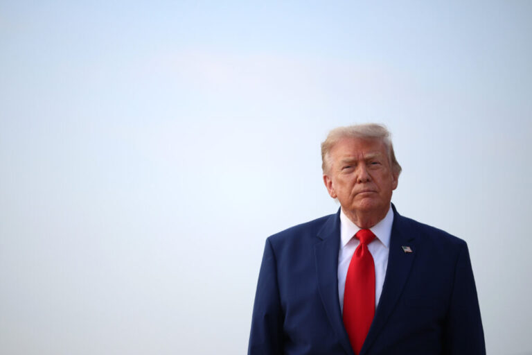 President Trump looks to reporters after getting off Air Force One this week at Joint Base Andrews, Maryland.