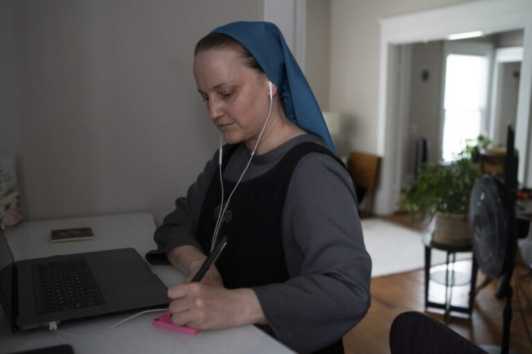 Sister Theresa takes a video call with her attorney in April.