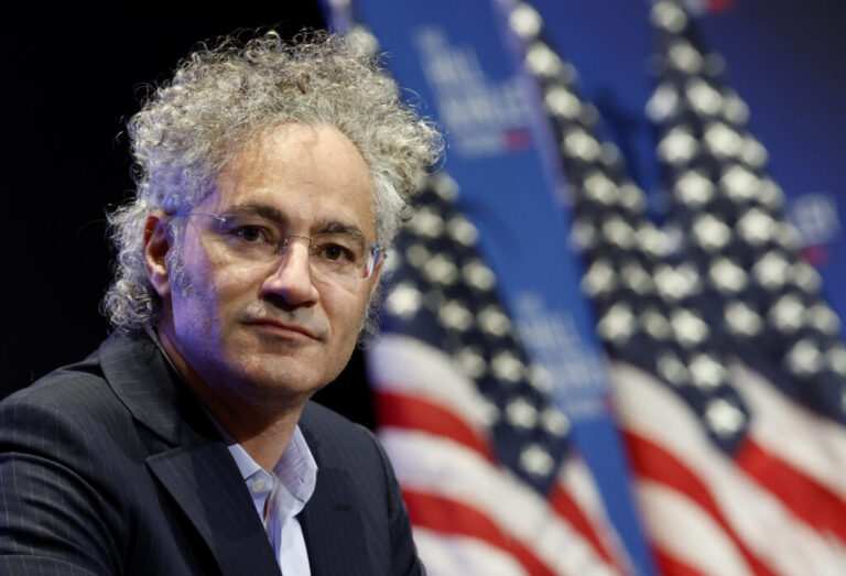 This photo shows Alex Karp, CEO of Palantir, photographed from about the shoulders up.